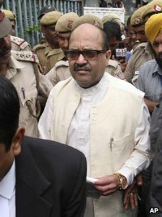 Amar Singh is surrounded by police officers as he is escorted to be taken to Tihar prison on 6 September 2011