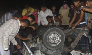 Wreckage of a car that killed an Islamic Jihad militant in Deir al-Balah, central Gaza Strip, 7 September