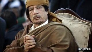 Libyan leader Muammar Gaddafi attends a ceremony marking the birth of Islam's Prophet Mohammed in Tripoli, in this February 13, 2011