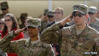 US. troops salute during an event to mark the 10th anniversary of the 9/11 attacks on the World Trade Center, at the US embassy in Kabul September 11, 2011.