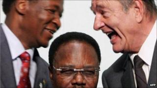 This file picture taken 16 February 2007 in Cannes shows French President Jacques Chirac (R) talking with President of Burkina Faso Blaise Compaore (L) behind Gabonese President Omar Bongo Ondimba