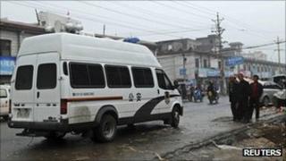 Police van at the scene of the attack in Gyongi on 14 September 2011