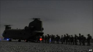 US and Afghan security forces board a Chinook helicopter in Kandahar province southern Afghanistan - 14 August 2011