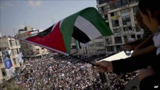 A girl waves a Palestinian flag during a rally in support of the Palestinian bid for statehood recognition at the UN, in the West Bank city of Ramallah, Wednesday 21 September