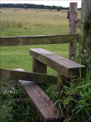 Stile separating two fields in the countryside