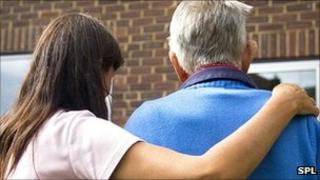 Generic image of woman helping an elderly man