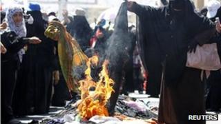 Women burn their veils in the Yemeni capital, Sanaa