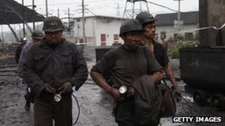 Rescue workers at a mine in Hunan province 3 July 2011