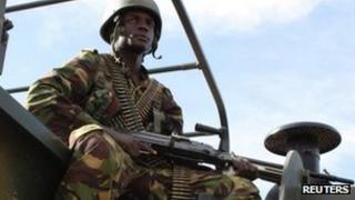 A Kenyan soldier keeps watch at the Garrisa airstrip near the Somali-Kenyan border 18 October 2011