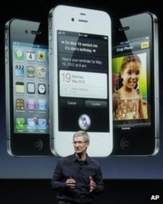 Apple chief executive Tim Cook promotes the iPhone 4S