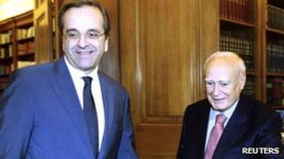 Greek President Karolos Papoulias (right) and New Democracy part leader Antonis Samaras at the presidential palace in Athens on 6 November 2011