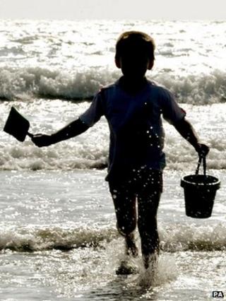 Child with buicket and spade