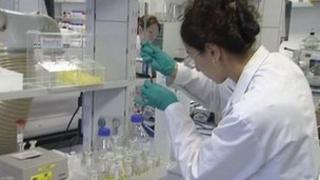 Almac scientist working in laboratory