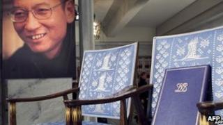 A picture of Liu Xiaobo next to his empty chair at the Nobel prize ceremony on 10 December 2010