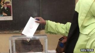 A woman votes at a school in Marrakech 25 November 2011