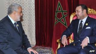 Abdelilah Benkirane (L), secretary general of the Justice and Development Party meets Morocco's King Mohammed VI in Midelt, 29 November 2011