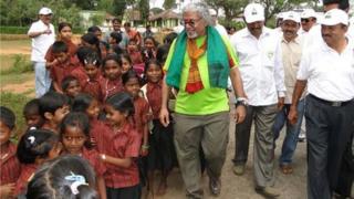Pushpanath Krishnamurthy walks with school kids in Karnataka