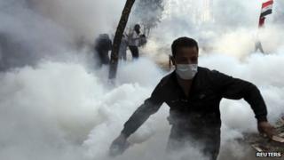 Protester throws tear gas canister back at police (November 2011)