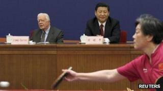 Former US President Jimmy Carter (L) sits with China's Vice President Xi Jinping during the 40th Anniversary Celebration of Ping Pong Diplomacy in Beijing, 8 December 2011