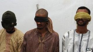 Three men presented as the kidnappers of two Frenchmen snatched in Hombori north east of Mali on November 24, are shown to the press on December 12, 2011 in Bamako.