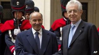 Libyan Transitional National Council chairman Mustafa Abdul Jalil (l) shakes hands with Italian Premier Mario Monti in Rome