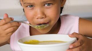 Child eating soup