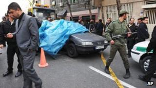 Iranian security forces at the scene of Mostafa Ahmadi-Roshan's killing