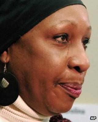 Elaine Riddick sheds a tear as she talks to the media following the task force meeting 10 January 2012