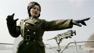 A North Korean guide shows tourists around the USS Pueblo