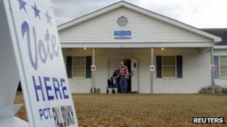 Voters leave the polling place in Fall Branch, South Carolina January 21, 2012