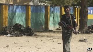 Nigerian soldier on patrol near site of Friday's suicide bombing (24 January)
