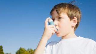 Boy with asthma inhaler