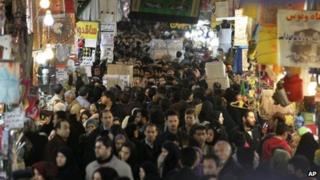 Iranians walk through the main old Bazaar of Tehran (26 January 2012)