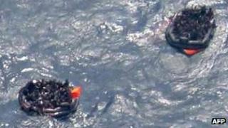 Aerial view of people in life-rafts after the ship sank on 2 February 2012