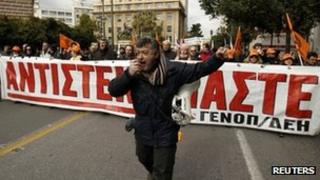 Members of Greece's public power corporation workers union (GENOP) march during a protest in Athens February 9