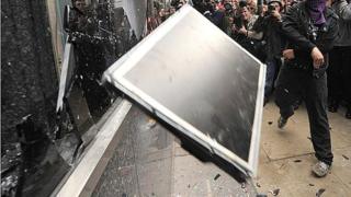 Computer screen being thrown through window