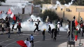 Police use tear gas to disburse protesters outside the capital Manama