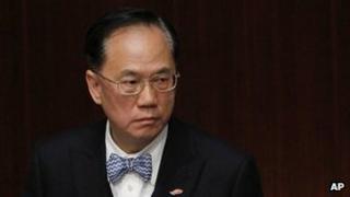 Hong Kong Chief Executive Donald Tsang reacts as he attends a question and answer session at the Legislative Council in Hong Kong Thursday, March. 1, 2012