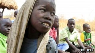 Okello Reagan, 11, who is suffering from nodding syndrome, sits with his peers in Akoya-Lamin Omony village in Gulu district, Uganda