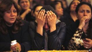 Egyptian Christian women mourn the death of Pope Shenouda III inside the cathedral of Cairo on 17 March 2012