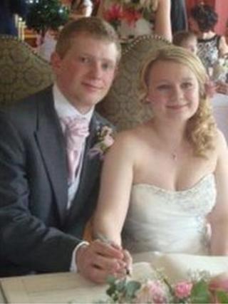 Robert Ballard and bride Alex signing their wedding certificate