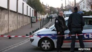 French police stand guard outside the Ozar Hatorah Jewish school a day after the shooting in Toulouse,