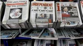 Budget headlines on newsstand