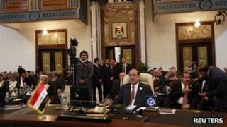 Nouri al-Maliki at the summit sitting with other delegates behind him