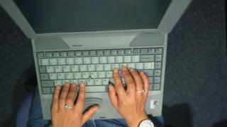 Hands on laptop keyboard