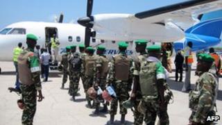 AU troops boarding a plane in Mogadishu to head for Baidoa, 5 April 2012