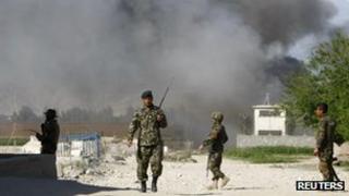 Afghan National army soldiers at the site of an attack, April 15 2012