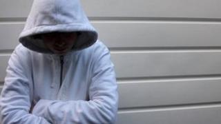 Youth in a hooded top (model)
