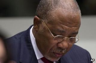 Former Liberian President Charles Taylor looks down in the courtroom of the Special Court for Sierra Leone in The Hague