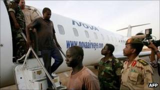 Men captured by Sudanese forces arrive in Khartoum